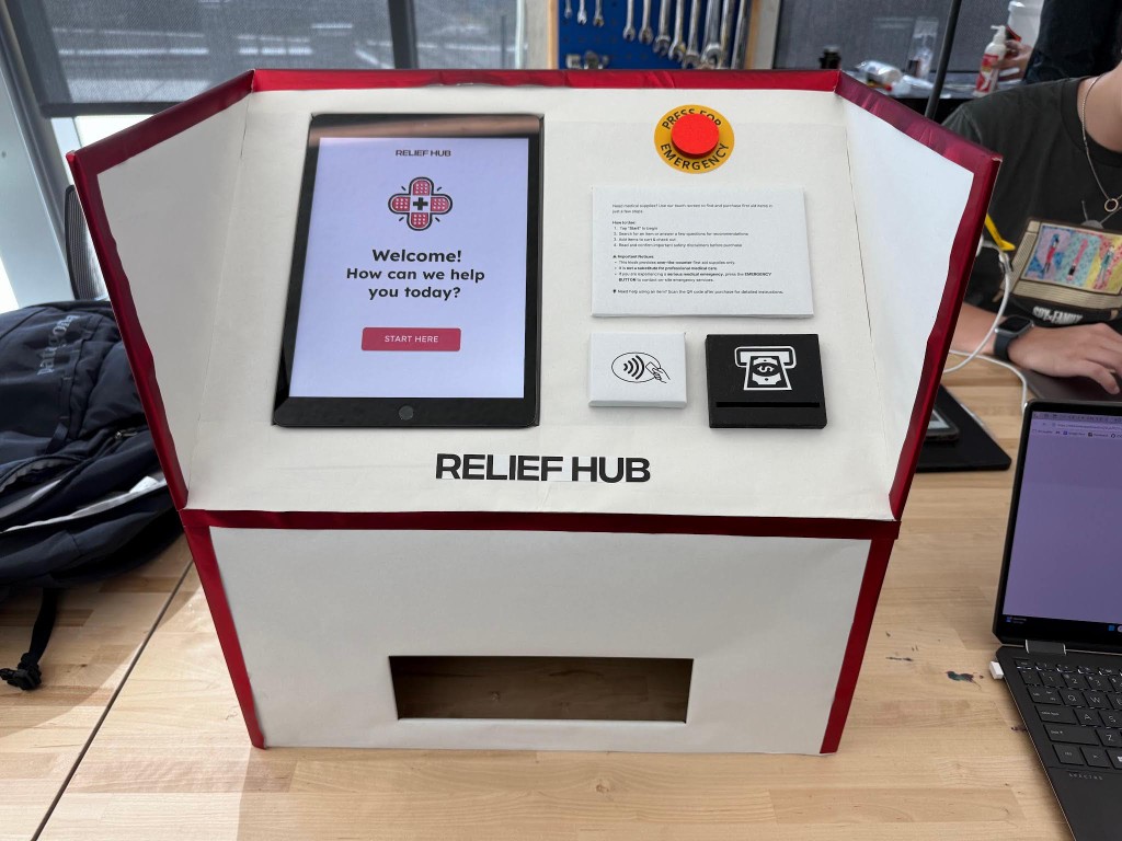 ReliefHub — kiosk render with tablet welcome UI